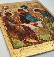 Load image into Gallery viewer, Holy Trinity Icon Silkscreen on Cotton Canvas - Gold Gilded Byzantine Greek Icon - in Wooden Frame Decorated With Crosses Comes With Stand For Standing and Hook For Hanging on Wall 7 1/4"x5 3/4"

